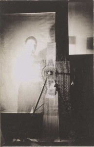 MAN RAY, Marcel Duchamp with Rotary Glass Plates Machine (in Motion), 1920